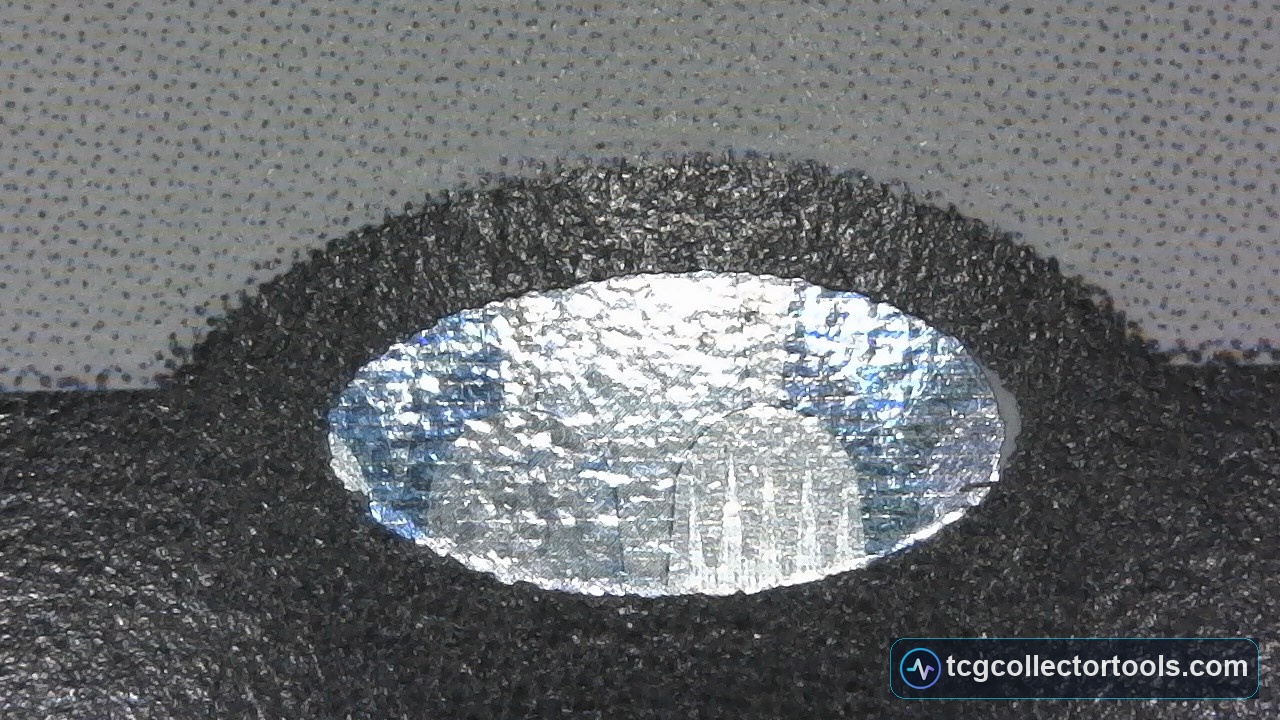 Counterfeit Magic card hologram sticker under magnification.