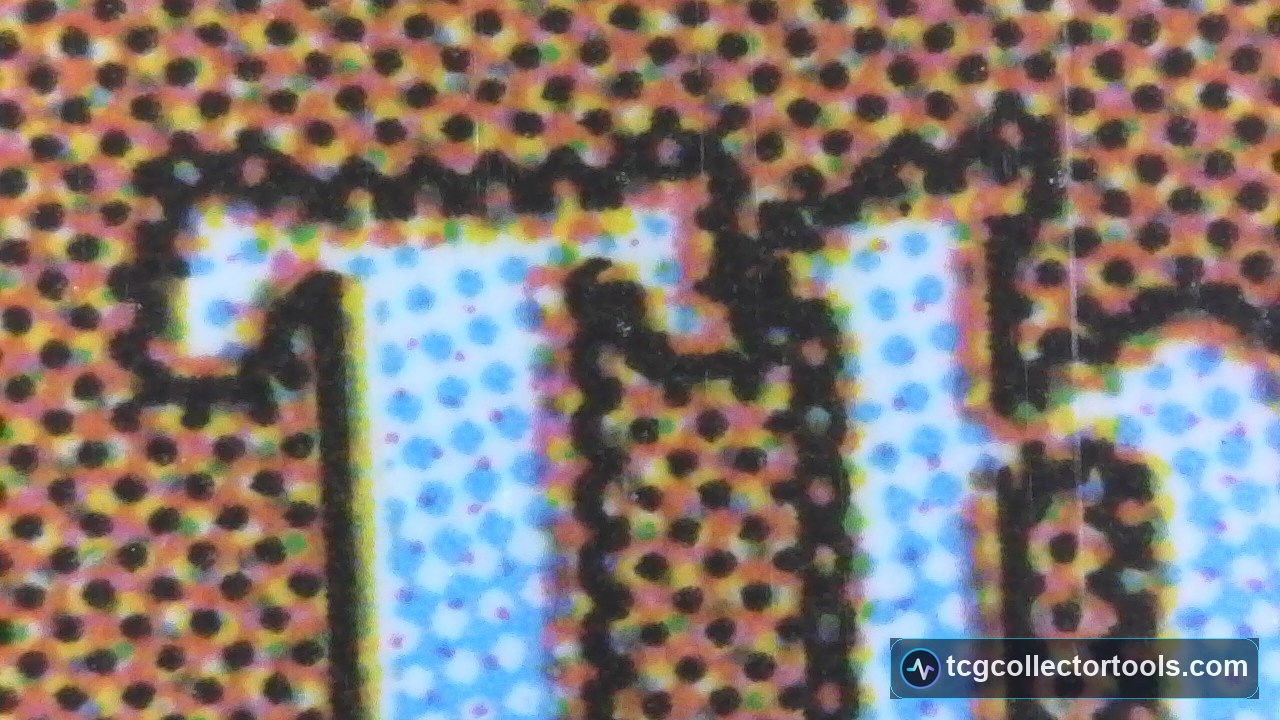 Macro of a genuine Magic card letter T with defined teeth in the black outline.