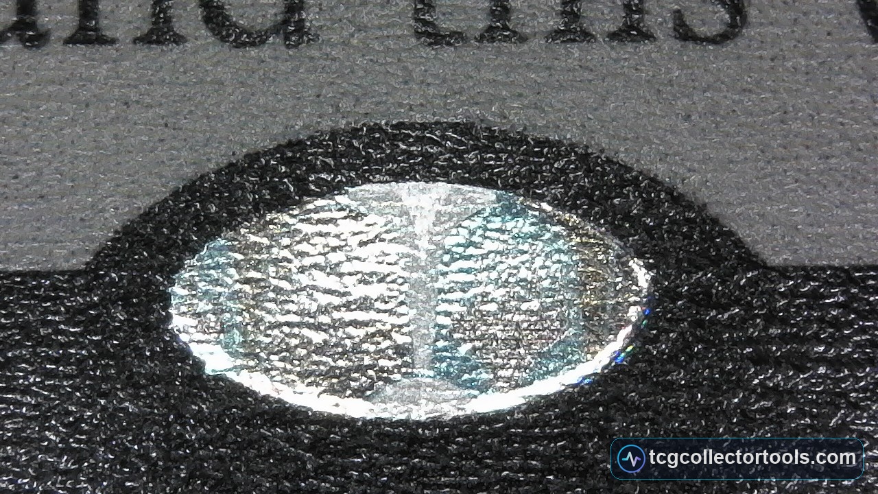 Genuine Magic card hologram sticker under magnification.